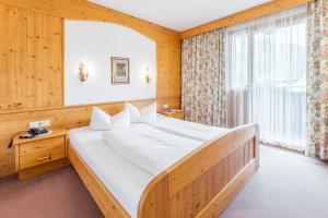 Katil atau katil-katil dalam bilik di Hotel Riedl im Zillertal