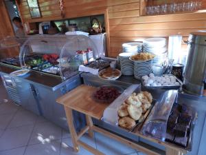 a kitchen with a bunch of food on a counter at Mercan Bungalow in Cıralı