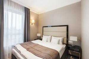 Postel nebo postele na pokoji v ubytování Hotel Mansor