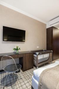 TV a/nebo společenská místnost v ubytování Hotel Mansor