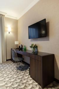 TV a/nebo společenská místnost v ubytování Hotel Mansor