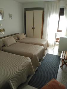 Postel nebo postele na pokoji v ubytování Hotel Puente de los Santos