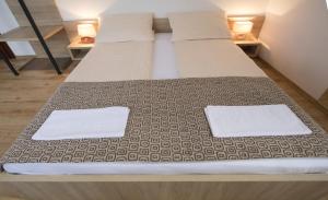 Letto o letti in una camera di Hotel Logavina 8 Garage Parking