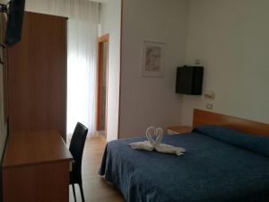Postel nebo postele na pokoji v ubytování Hotel Atlas
