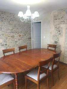 
a dining room table with chairs around it at Maison centre Bayeux 5 chambres 10 personnes in Bayeux
