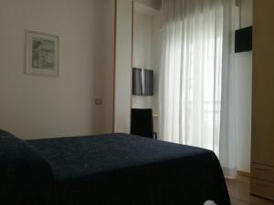 Postel nebo postele na pokoji v ubytování Hotel Atlas
