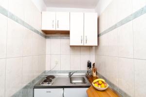 Kuchyň nebo kuchyňský kout v ubytování Rooms Karla