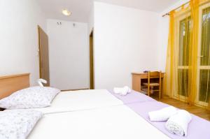 Postel nebo postele na pokoji v ubytování Rooms Karla