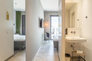 Postel nebo postele na pokoji v ubytování gambino hotel CINCINNATI + 37 fotografií