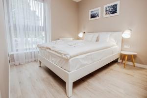 Łóżko lub łóżka w pokoju w obiekcie Apartment No. 1 - Vento Apartamenty