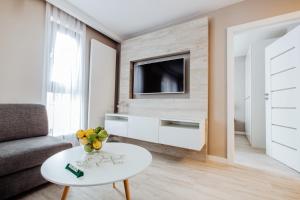 Telewizja i/lub zestaw kina domowego w obiekcie Apartment No. 1 - Vento Apartamenty