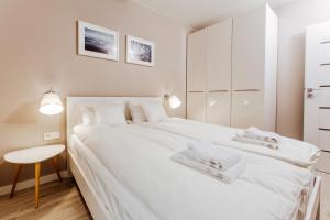 Łóżko lub łóżka w pokoju w obiekcie Apartment No. 1 - Vento Apartamenty