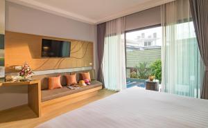 Postel nebo postele na pokoji v ubytování AVA SEA Resort Krabi, Ao Nang Beach + 37 fotografií