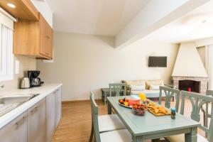 A kitchen or kitchenette at Trefon Hotel Apartments and Family Suites