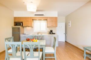 A kitchen or kitchenette at Trefon Hotel Apartments and Family Suites