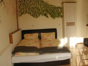 Posteľ alebo postele v izbe v ubytovaní Kiserdei Apartman