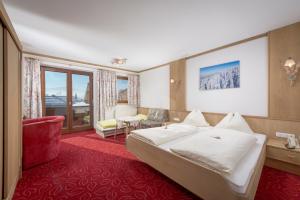 Łóżko lub łóżka w pokoju w obiekcie Familienhotel Central