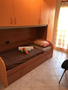 Ένα ή περισσότερα κρεβάτια σε δωμάτιο στο Casa Vacanze dell'aviatore