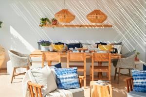 a dining room with a table and chairs at Nausicaa Luxury Villas in Protaras