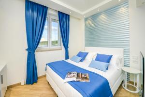 Posteľ alebo postele v izbe v ubytovaní Hotel Villa Garuti