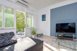 a living room with a large flat screen tv at Apartment Maja in Split