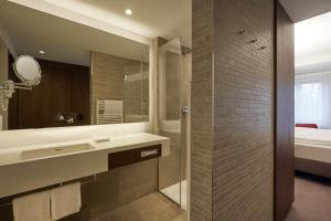 Ein Badezimmer in der Unterkunft HYPERION Hotel Berlin