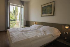 Postel nebo postele na pokoji v ubytování Hotel Al Caval