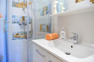 a bathroom with a sink and a shower at Villa Ive in Mlini +59 photos