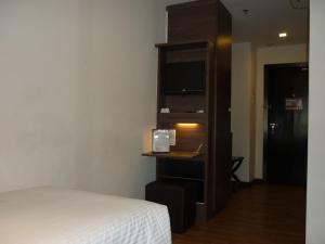 Postel nebo postele na pokoji v ubytování Frenz Hotel Kuala Lumpur