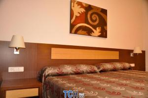 Postel nebo postele na pokoji v ubytování TCH Hotel
