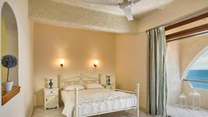 Cama ou camas em um quarto em Hotel Abatis