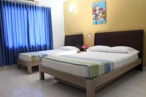 Voodi või voodid majutusasutuse Bosque Hotel toas