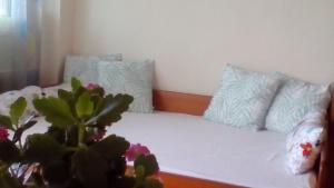 A bed or beds in a room at Phyllis Maisonettes