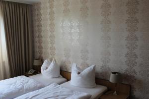 Postel nebo postele na pokoji v ubytování Osterberg - Restaurant und Hotel