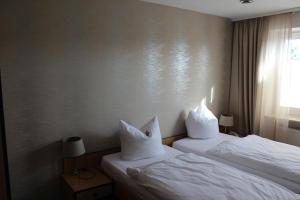 Postel nebo postele na pokoji v ubytování Osterberg - Restaurant und Hotel