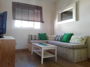 Televízia a/alebo spoločenská miestnosť v ubytovaní Apartamento Pura Vida