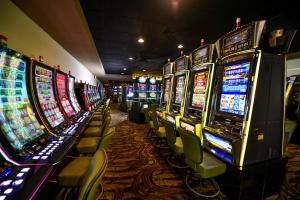 a row of slot machines in a casino at Barceló Aruba - All Inclusive in Palm-Eagle Beach