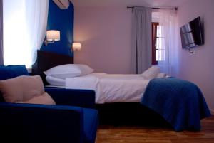 Posteľ alebo postele v izbe v ubytovaní Old Town Inn