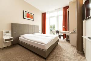 Postel nebo postele na pokoji v ubytování Hotel Spree-idyll