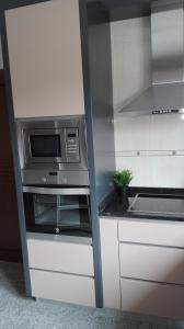 Kuchyň nebo kuchyňský kout v ubytování VistaFreita- Rooms & Suites