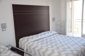 Postel nebo postele na pokoji v ubytování Hotel Trieste + 12 fotografií