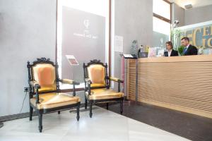 two chairs sitting at a counter in a store at Soho Boutique Casa Don Fernando in Cáceres