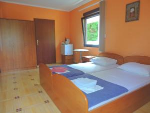 Postel nebo postele na pokoji v ubytování Villa Budvanka Guesthouse