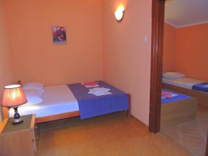Postel nebo postele na pokoji v ubytování Villa Budvanka Guesthouse