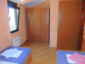 Postel nebo postele na pokoji v ubytování Villa Budvanka Guesthouse