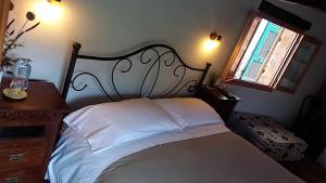 Postel nebo postele na pokoji v ubytování B&B Da Giua'