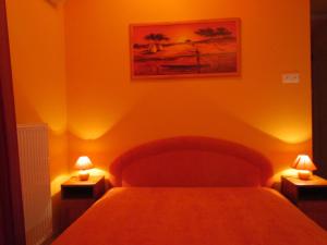 Postel nebo postele na pokoji v ubytování Balaton Wellness Apartman