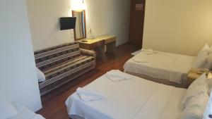 Postel nebo postele na pokoji v ubytování Hotel Berlin