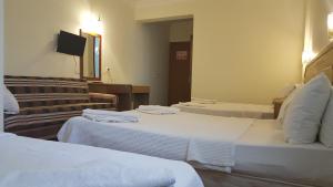 Postel nebo postele na pokoji v ubytování Hotel Berlin