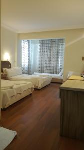 Postel nebo postele na pokoji v ubytování Hotel Berlin